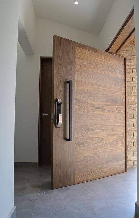 Timber pivot entrance door with integrated smart lock