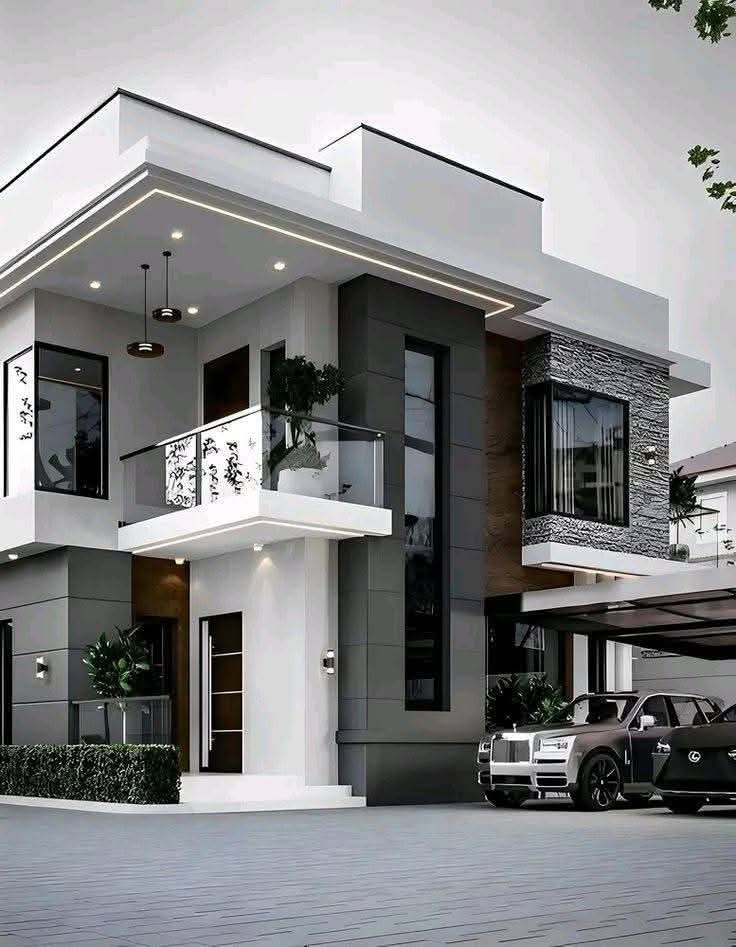 Contemporary white residence with stone cladding and glass balconies
